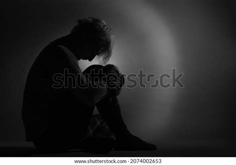 Silhouette Depressed Sad Boy Sitting Hugging Stock Photo 2074002653