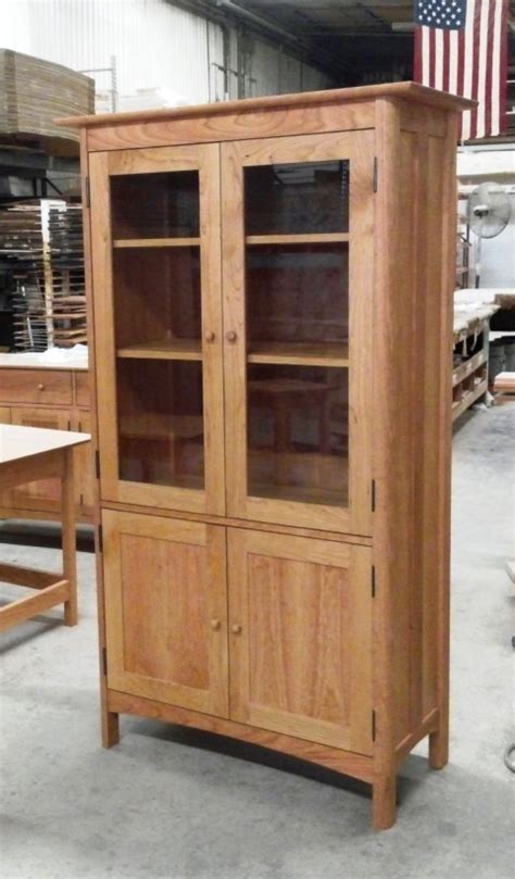 South shore asten bookcase headboard with doors fall oak. 4-door bookcase