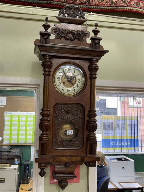 Victorian Walnut Vienna Style Pendulum Wall Clock Having Enamelled And Gilt Decorated Dial And