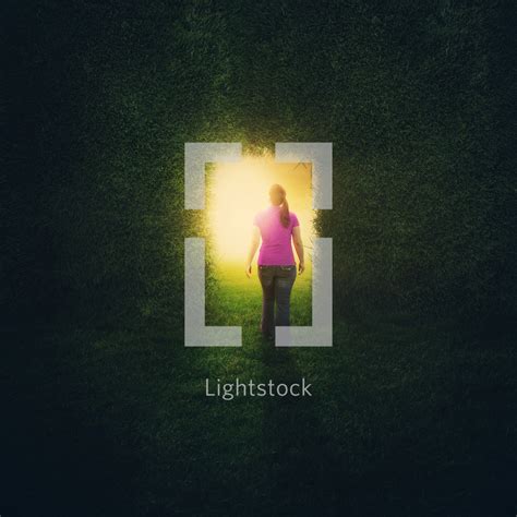 A Woman Walking Into The Light — Photo — Lightstock