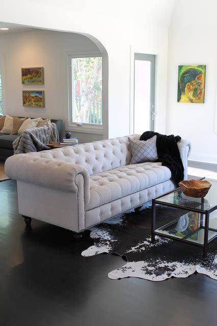 Or if the back of your couch faces open space instead of a wall, place a sofa table behind it. Living Room Decor - Tufted Sofa