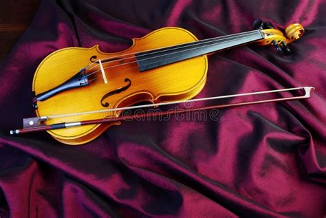 Violin On A Color Background Violin On A Purple Silk Background Stock