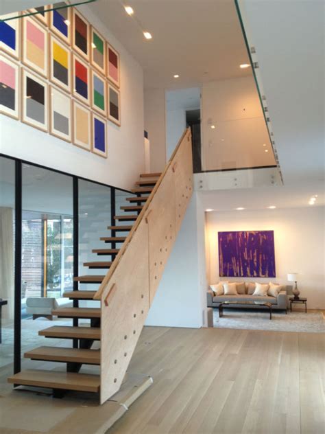 We believe in giving back! hanging pictures in staircase Archives - ILevel
