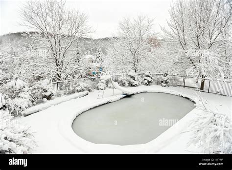 Backyard Swimming Pool In Winter After Heavy Snow Fall Storm Covered