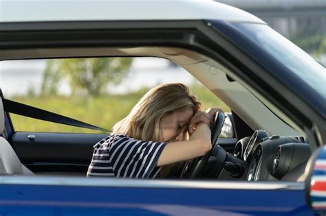 Premium Photo Tired Woman Lean On Steering Wheel In Car Driving