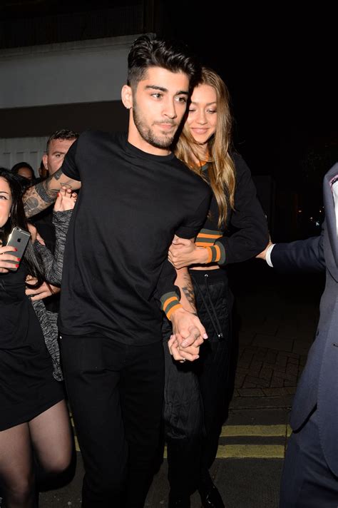 Yolanda hadid, gigi hadid, and zayn malik. Zayn and Gigi Hadid leaving the Versus Versace SS17 show ...