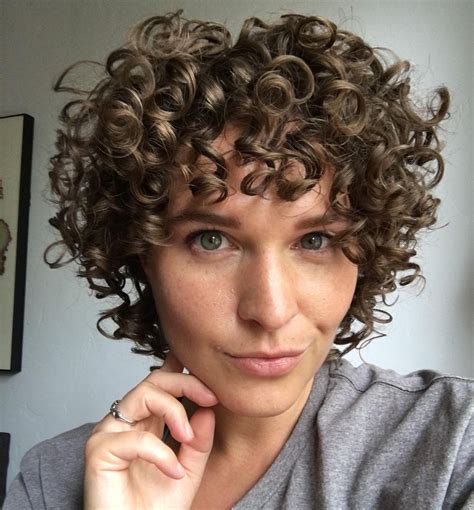 21 best short curly hair with bangs to try this year curly shag haircut thick curly hair short