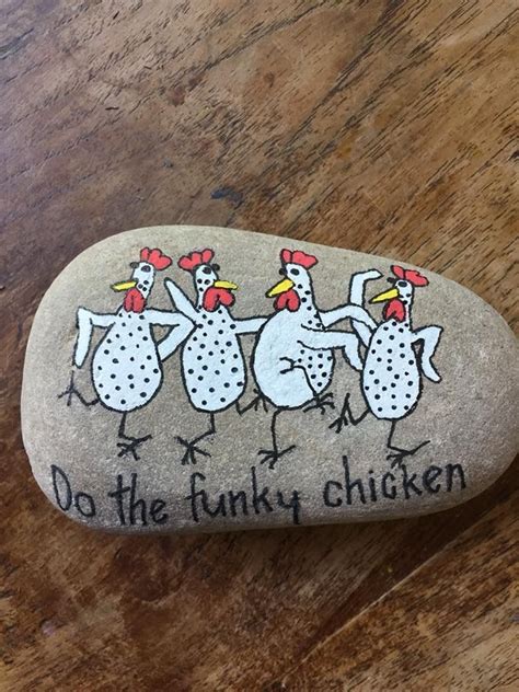 A Rock With Three Chickens Painted On It And The Words Do The Funky
