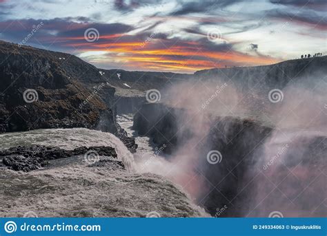 Beautiful Gullfoss Waterfall In Golden Circle Against Cloudy Sky During