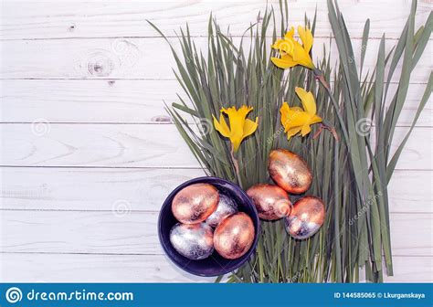 Easter Golden Eggs And Daffodils On Wood Background Stock Image Image