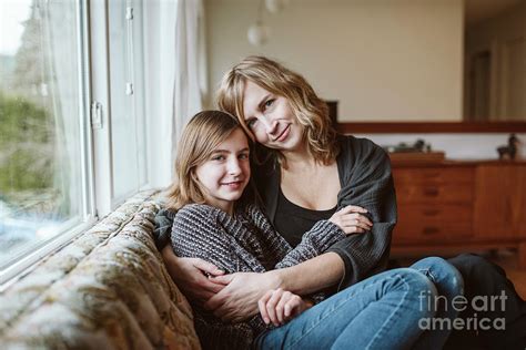 Portrait Affectionate Mother And Daughter Cuddling Photograph By Caia Imagescience Photo Library