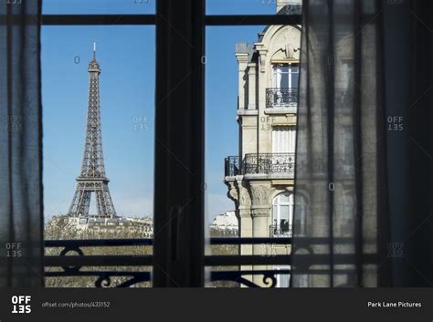 Eiffel Tower Visible From A Window In Paris France Stock Photo Offset