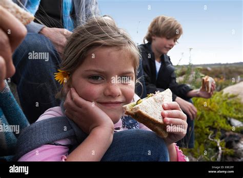 Girl Eating Sandwich Stock Photo Alamy