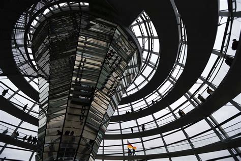 People Walk Inside The Dome Of The Reichstag Building In Berlin