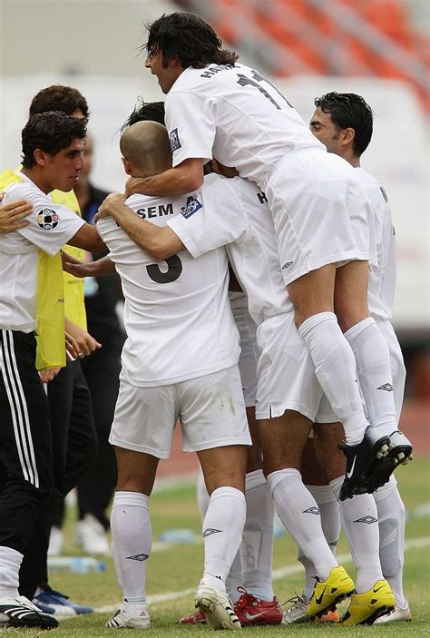 It also shows record winners and champion managers. Players from Iraq celebrate a goal during the AFC Asian ...