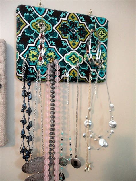 It looks gorgeous and whimsical with all the jewelry racked up on the wall. How to Make Your Own Wall-Mounted Jewelry Organizer