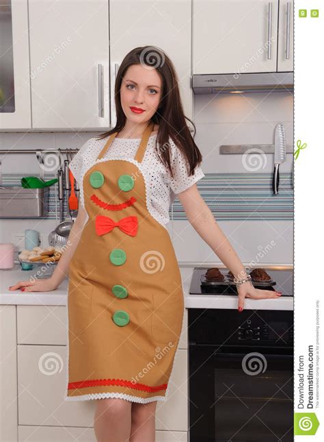 Woman In Apron With Cupcakes In Kitchen Stock Photo Image Of Happy
