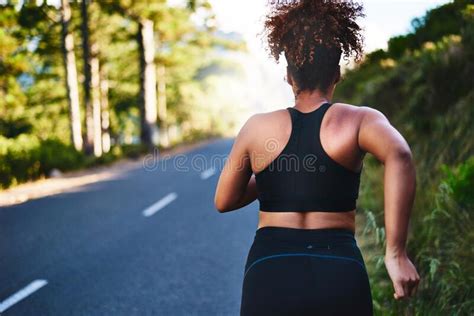 Keep Going Till You Get To The End Rearview Shot Of A Young Woman Out