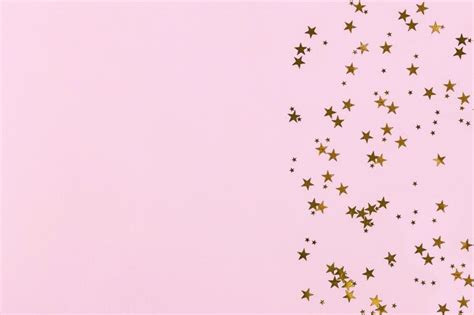 Premium Photo Golden Sparkles On Pink Background
