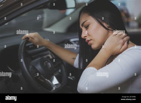 Beautiful Young Woman Rubbing Her Neck Feeling Sore After Long Drive