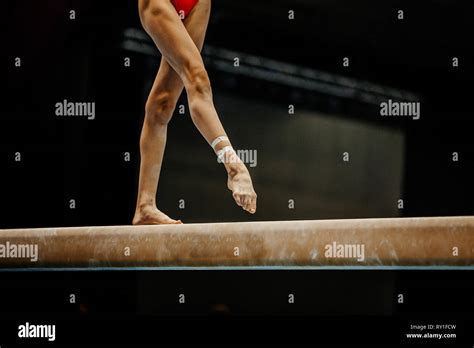 Legs Woman Gymnast Exercise Balance Beam In Artistic Gymnastics Stock