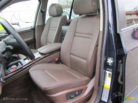 The highlander faces models like the honda if you have issues with the liftgate / trunk door and want to reset it, you can be set to open to a specific height by performing the following step Tobacco Nevada Leather Interior 2009 BMW X5 xDrive30i Photo #60547762 | GTCarLot.com