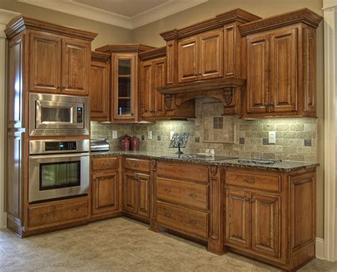 Grey cabinets, grey tiles, and grey decor can lend a sophisticated air to a kitchen. grey granite countertops with brown cabinets - Google ...