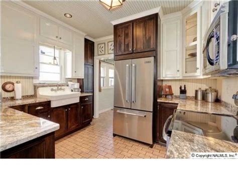 Luckily, there are few rules about cabinet placement. Two tone cabinets in kitchen... white upper, dark wood lower. (would have painted the cabinets ...