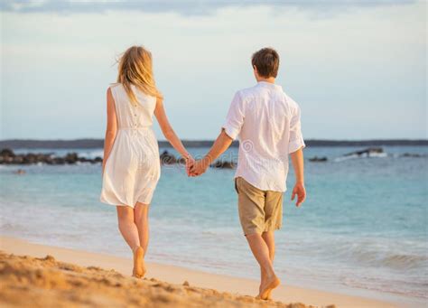 Romantic Happy Couple Walking On Beach At Sunset Stock Image Image 35119831