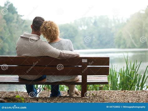 Rear View Couple Sitting On Bench Outdoors Stock Photo Image 44753802