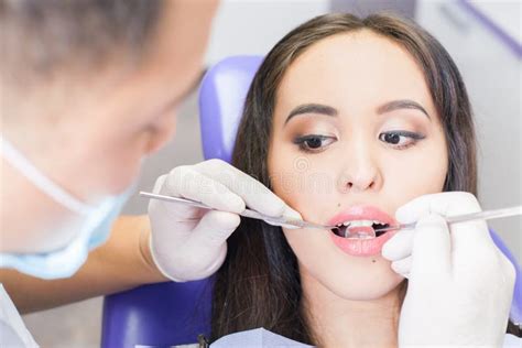 Dentist Doctor Treats Teeth Patient Girl In Dental Office Stock Image Image Of Exam Doctor
