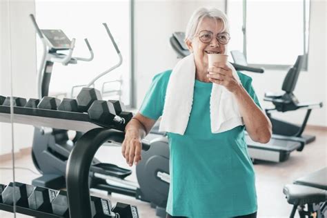 Premium Photo Active Smiling Senior Woman Drinks A Water Glass Doing