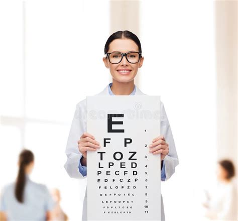 Young Attractive Business Woman In Eyeglasses And Eye Test Chart Stock