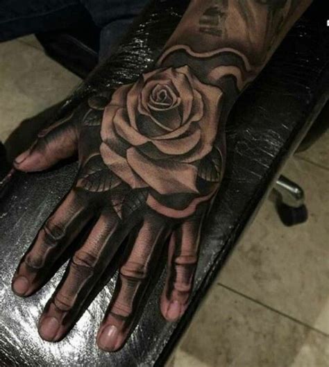 Pin By Star Bunni On Tattoos Rose Hand Tattoo Hand Tattoos For Guys