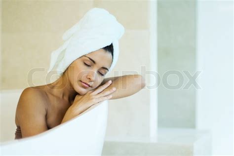 ©odilon Dimieraltopressmaxppp Woman Sitting In Bathtub With Towel Wrapped Around Hair Head