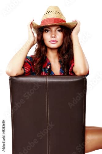 Woman Cowgirl Sitting On A Chair Isolated On White Kaufen Sie Dieses