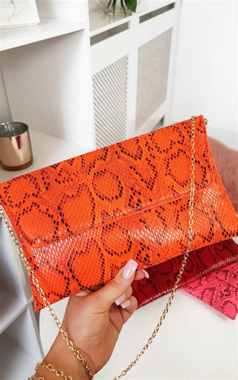 Melinda Snake Print Envelope Clutch Bag In Coral Ikrush