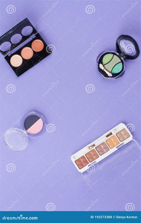 Vaarious Cosmetic Powders On A Purple Background Stock Photo Image