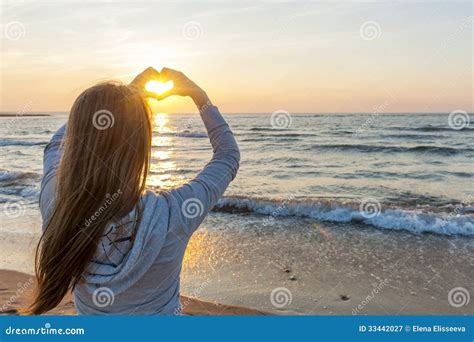Girl Holding Hands In Heart Shape At Beach Stock Image Image Of Ocean