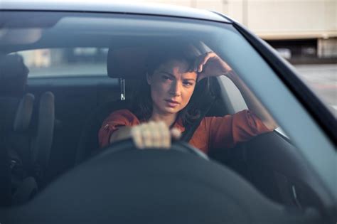 Premium Photo Nervous Female Driver Sits At Wheel Has Worried