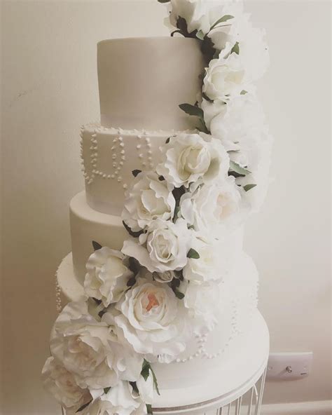 The cut end should be touching the piping slowly peel off each individual flower from the wax paper and transfer onto the cake. Wedding Cakes — Ministry Of Cakes