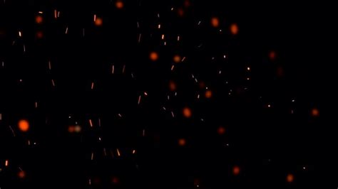 High Speed Shot Of Fire Flames And Glowing Ash Particles On Black