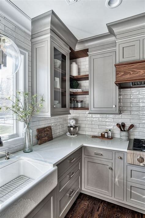 The navy and white color scheme is accented with the wood on the sleek modern bar stools and the lovely wooden floor. 25+ Ways To Style Grey Kitchen Cabinets | Grey kitchen ...