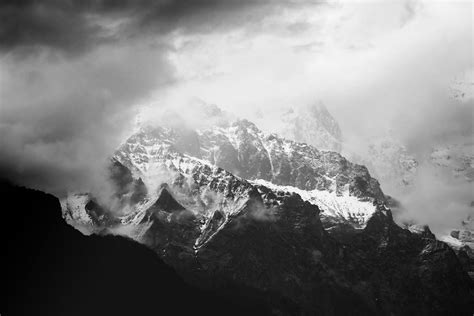 Grayscale Photo Of Snow Covered Mountains · Free Stock Photo