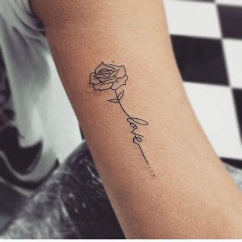 A Small Rose Tattoo On The Arm