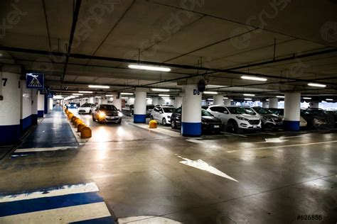Underground Parking Garage Interior With A Few Parked Cars Stock