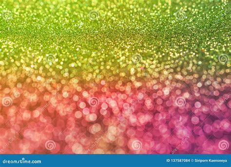 Colorful Glowing Green And Pink Shiny Glitters Texture Background Stock