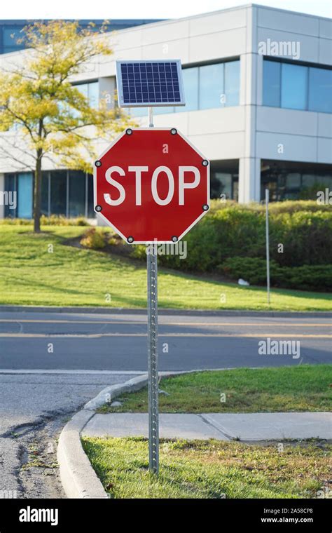 Solar Powered Stop Sign Outdoor In A Business Office Area Stock Photo