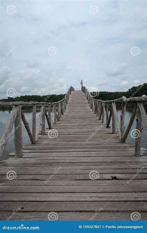 Resak Tembaga Wooden Bridge In A Lake Under Cloudy Sky Stock Image