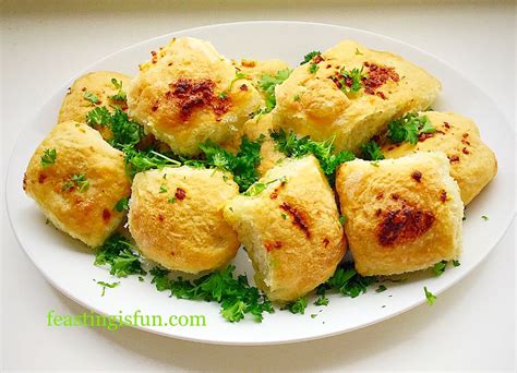Chop the tops of the garlic and wrap in tin foil. Garlic Cheese Bombs - Feasting Is Fun